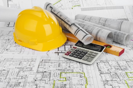 35996532 - yellow helmet, calculator, level and project drawings